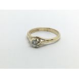 A 9ct gold solitaire diamond ring, approx .15ct, a