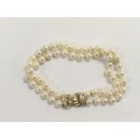A 14ct gold, pearl and diamond bracelet.