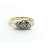 An 18ct gold three stone diamond ring, approx 1/2ct, approx 4.6g and approx size N-O.