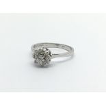 An 18carat white gold ring set with a pattern of diamonds. Ring size J-K
