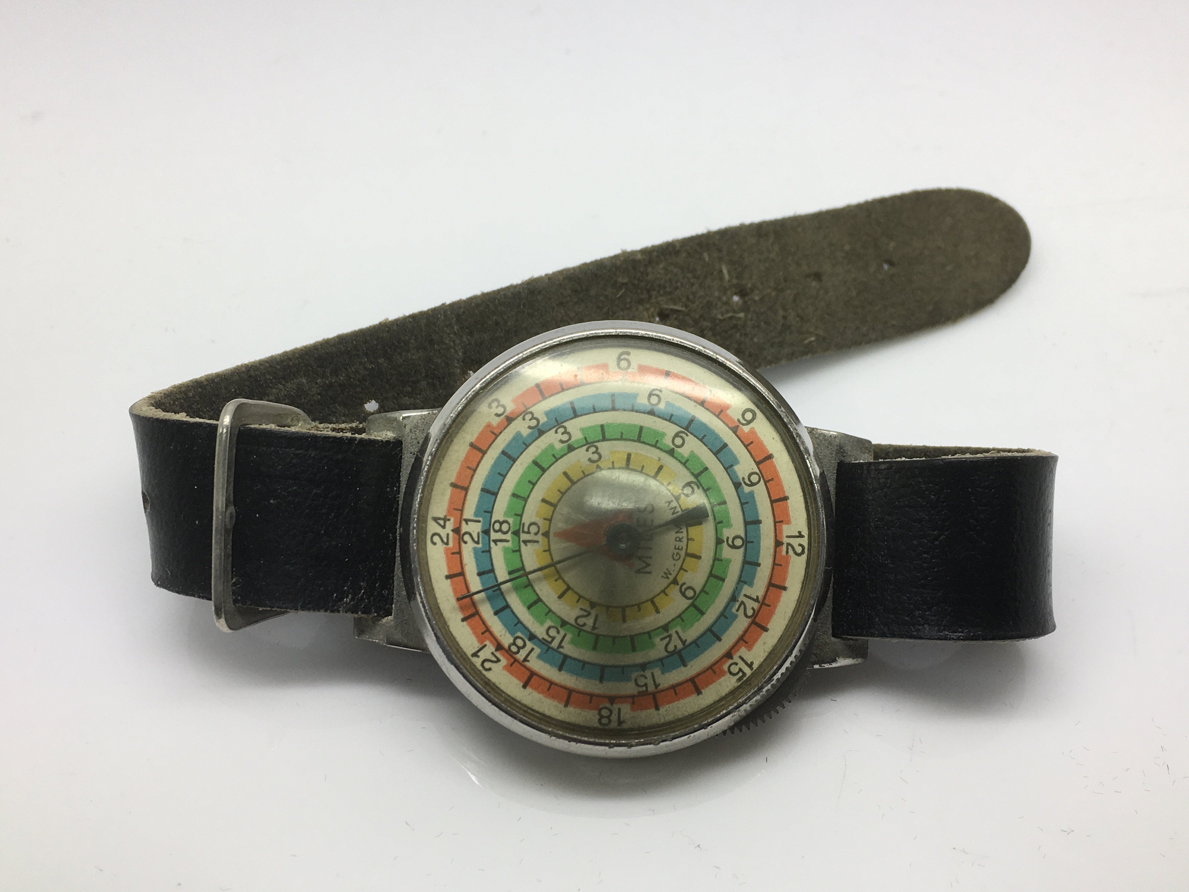 A vintage Miles of West Germany wrist pedometer.