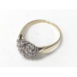 A 9ct gold and diamond cluster ring (T), 1 stone m