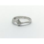 An 18ct white gold solitaire diamond ring set with a princess cut diamond, approx .25ct, approx 2.2g