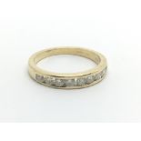 An 18ct gold half eternity ring set with nine diamonds, approx 1/2ct, approx 2.8g and approx size