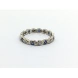 An 18ct white gold ring set with diamonds and sapphires, approx 2.5g and approx size M.
