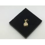 An 18ct gold solitaire diamond pendant, approx 0.1