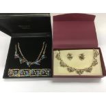 Two jewellery sets decorated with gem stones.