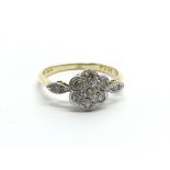 A vintage 18ct gold ring set with diamonds in the
