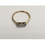 A 18 ct gold ring inset with 3 diamonds size p .
