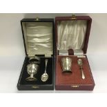 Two boxed silver christening sets, different assay
