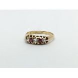 An 18ct gold vintage ruby and three diamond ring,