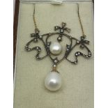 A boxed Art Nouveau style necklace set with diamon