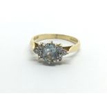 An 18ct gold ring set with aquamarine and diamonds