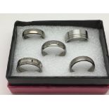 Five gents titanium rings including a diamond set