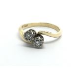 An 18ct gold ring set with two diamonds, approx .13ct, approx 3.5g and approx size N-O.