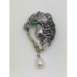 An Art Nouveau style silver brooch set with a pear