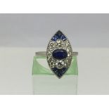 A platinum ring set with diamonds and sapphires, t