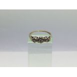 A 9ct gold three stone diamond ring, approx 2g and