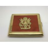 A gold tone cigarette case with German coat of arm