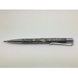 A silver pen, made in Israel, with elaborate decor