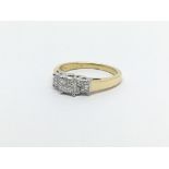 An 18ct gold diamond ring set with 12 princess cut