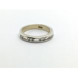 A white gold half eternity ring set with diamonds, approx 3g and approx size M.