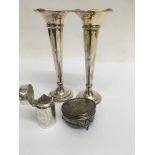 Two silver trumpet vases a silver perfume bottle a