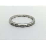 A 9ct white gold half eternity diamond ring, appro