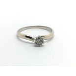 An 18ct white gold seven stone diamond ring in the