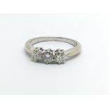 An 18ct white gold three stone diamond ring, approx 1/2ct, approx 2.9g and approx size L.