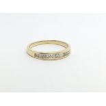 An 18ct gold half eternity ring set with ten small diamonds, approx 2.2g and approx size M.