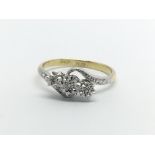 An 18carat gold and platinum ring set with three diamonds ring size M.