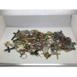 A bag of jewellery items including rosary beads, c