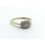 A 9carat yellow gold ring set with a pattern of diamonds approximately 0.20 of a carat ring size S.