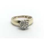 A 9ct gold eight stone diamond cluster ring, approx 2g and approx size I.