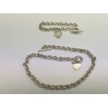 A sterling silver necklace and bracelet set.