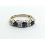 A gold ring set with sapphires and diamonds, approx 2.3g and approx size L.