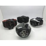 Four watches including two Casio G Shock examples.