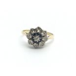 A circa 1950s gold sapphire and diamond cluster ring, approx 3.3g and approx size L.