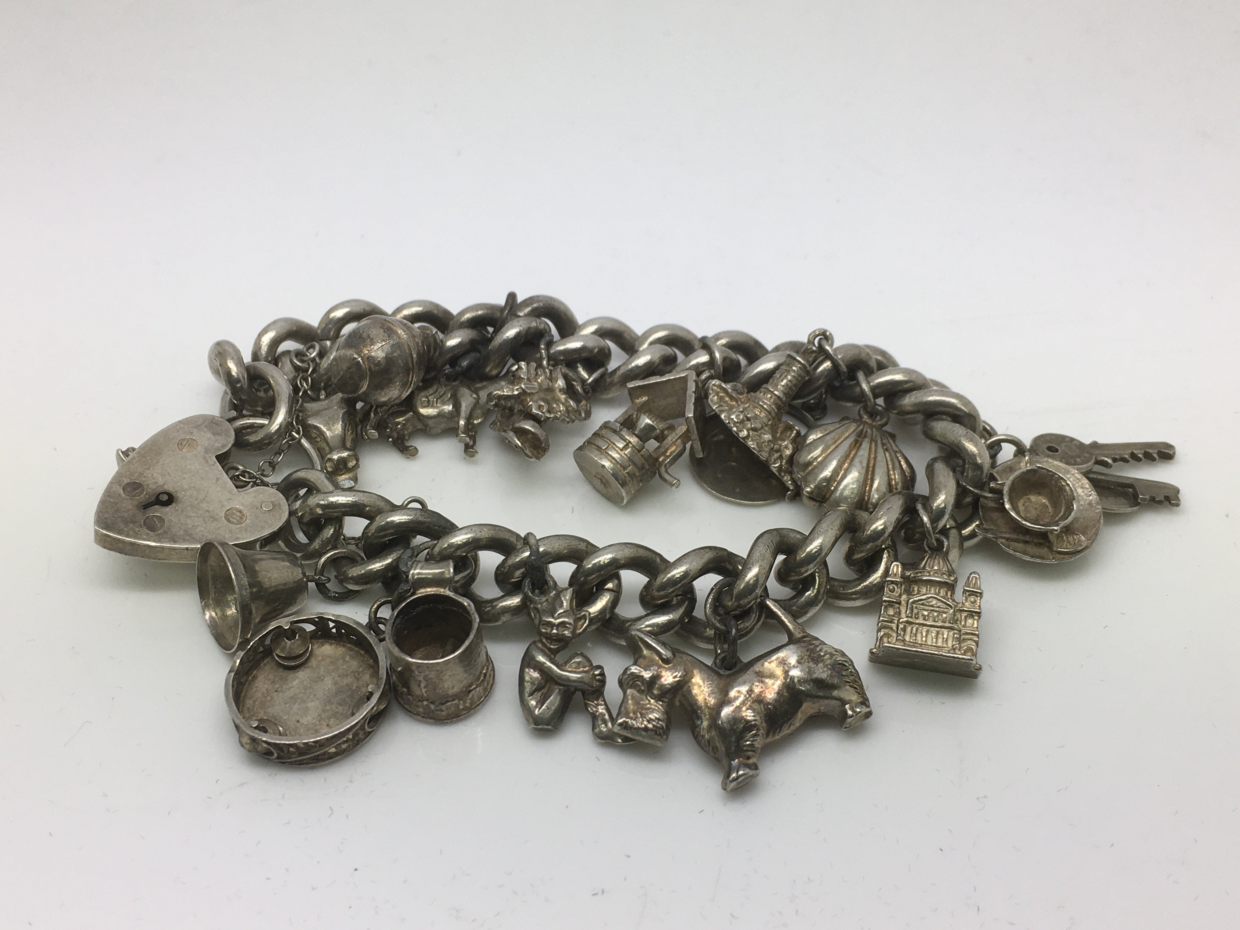 A heavy sterling silver charm bracelet, approx 89g