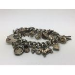 A heavy sterling silver charm bracelet, approx 89g