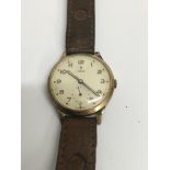 A vintage Tudor wrist watch with applied leather s