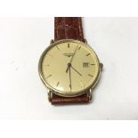 A gents 18ct gold Longines wrist watch with date a