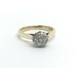 A 9ct gold seven stone diamond cluster ring, approx 2.3g and approx size J-K.