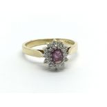 An 18ct yellow gold ruby and diamond set ring ( N/O), approx 3.5g.