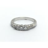 An 18carat white gold ring set with three diamonds 0.25 of a carat ring size O.