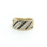 An 18ct gold sapphire and diamond set ring, (L/M) approx 7.2g