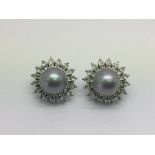 A pair of good quality earrings marked 975 and set