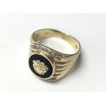 A 14ct gold and stone set Versace style ring.