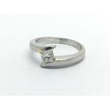 A platinum solitaire diamond ring set with a princess cut diamond, approx .25ct, approx 4.9g and